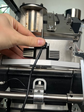 Refastening drop door motor
