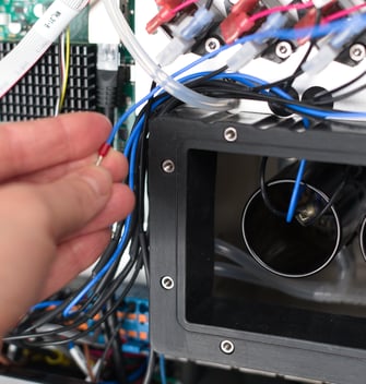 Pass neutral cable behind pressure sensor tubing