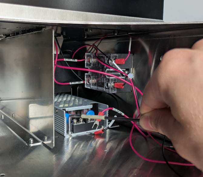 remove bolts securing 48V PSU